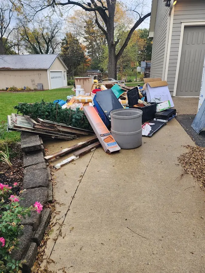 Dumpster being loaded with debris for Roofing Dumpster Rental in La CaÃÂ±ada Flintridge